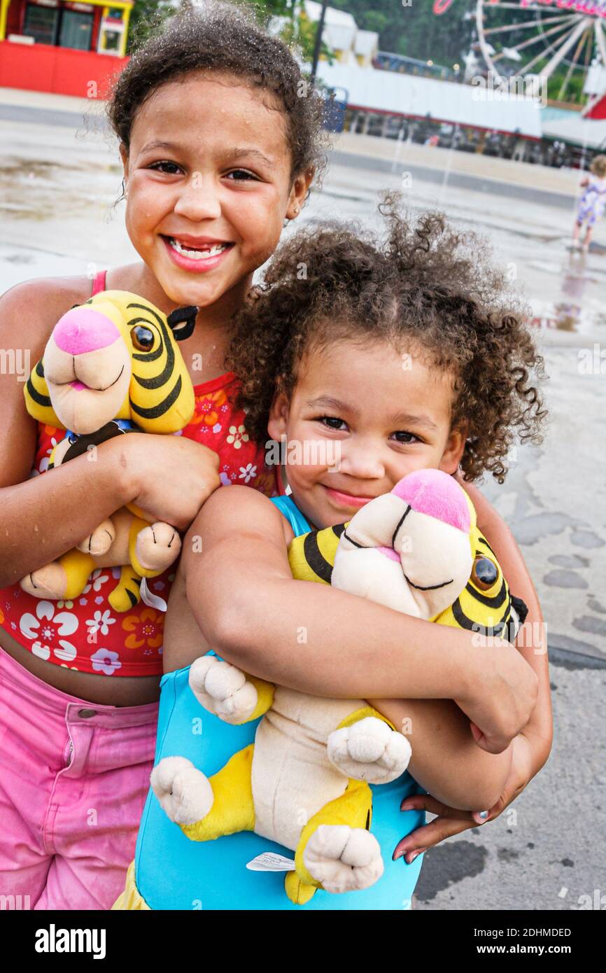 Birmingham Alabama,Splash Adventure formerly VisionLand Magic Adventure Theme Park,Black sisters girls holding stuffed tiger animal animals, Stock Photo