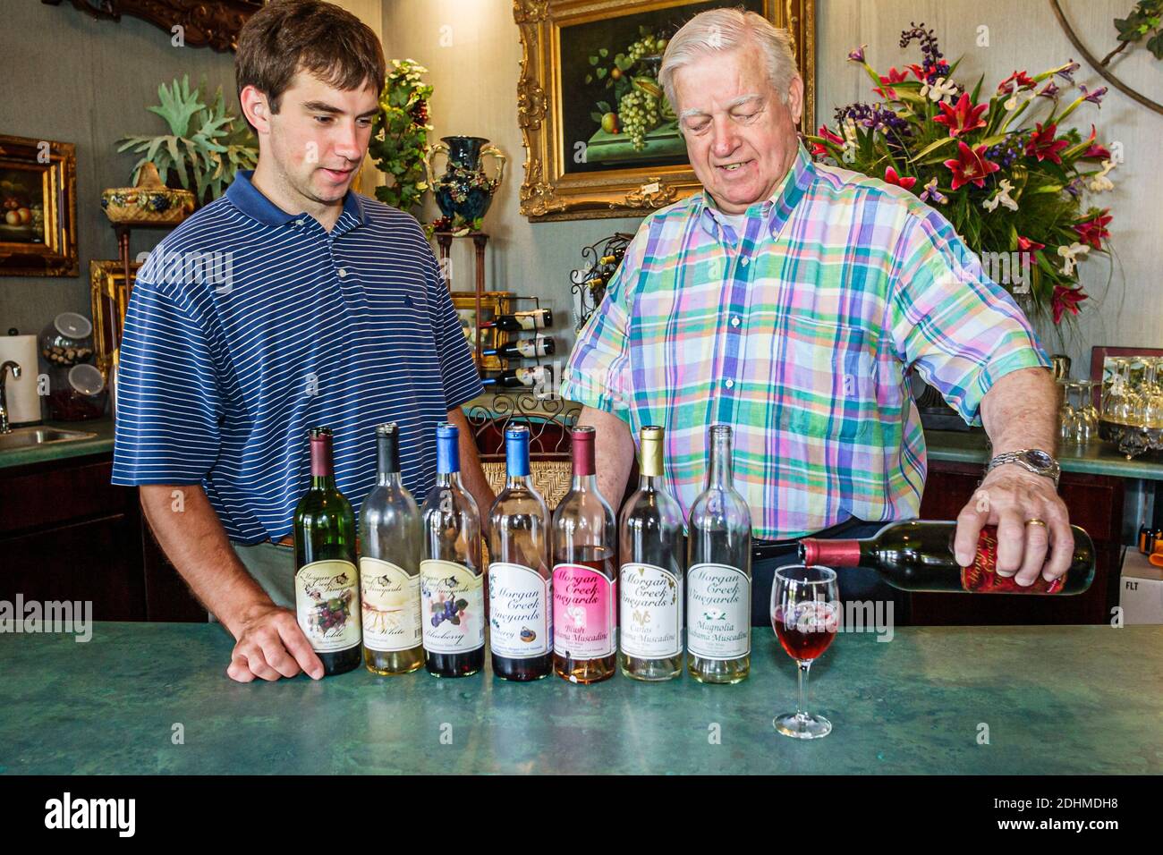 Alabama Harpersville Morgan Creek Vineyards,winery tasting room grandfather grandson family business,wine samples bottles, Stock Photo