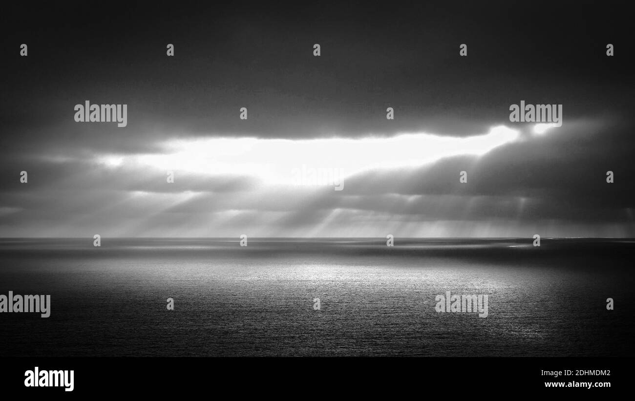 Dramatic Sky over the ocean in black and white Stock Photo - Alamy