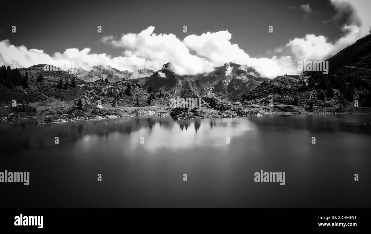 Flight over a wonderful mountain lake in the Swiss Alps - Lake T in black and white Stock Photo