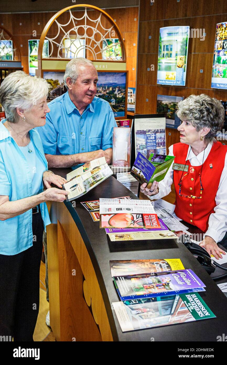 Huntsville Alabama,Visitors Center centre,senior seniors man woman female couple brochure leaflet folder pamphlet information,volunteer helping helps, Stock Photo
