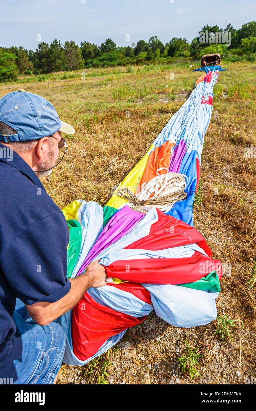 Alabama Decatur Alabama Jubilee Hot Air Balloon Classic,flight crew gathering retrieving folding teamwork man, Stock Photo