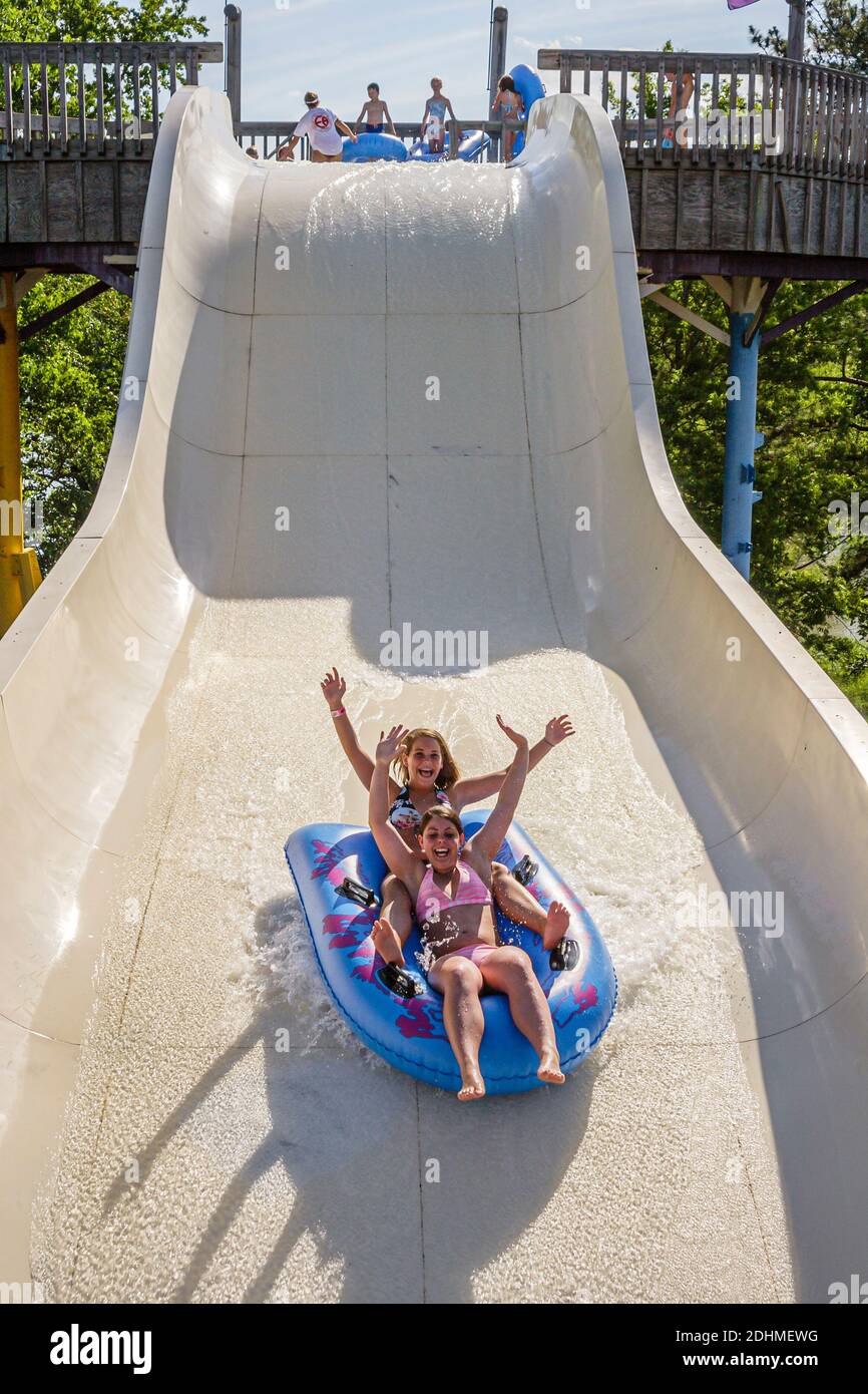 Alabama Decatur Point Mallard Park Waterpark,water slide riding down teen teens teenage teenagers girls, Stock Photo