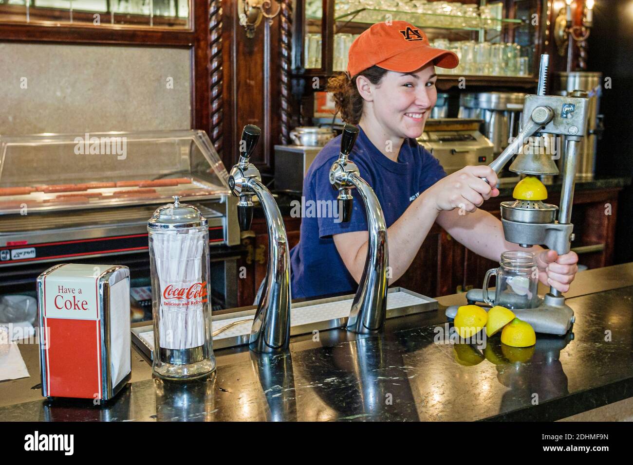 Alabama Auburn Toomer's Drugs fresh squeezed lemonade local tradition,woman female counter female employee, Stock Photo