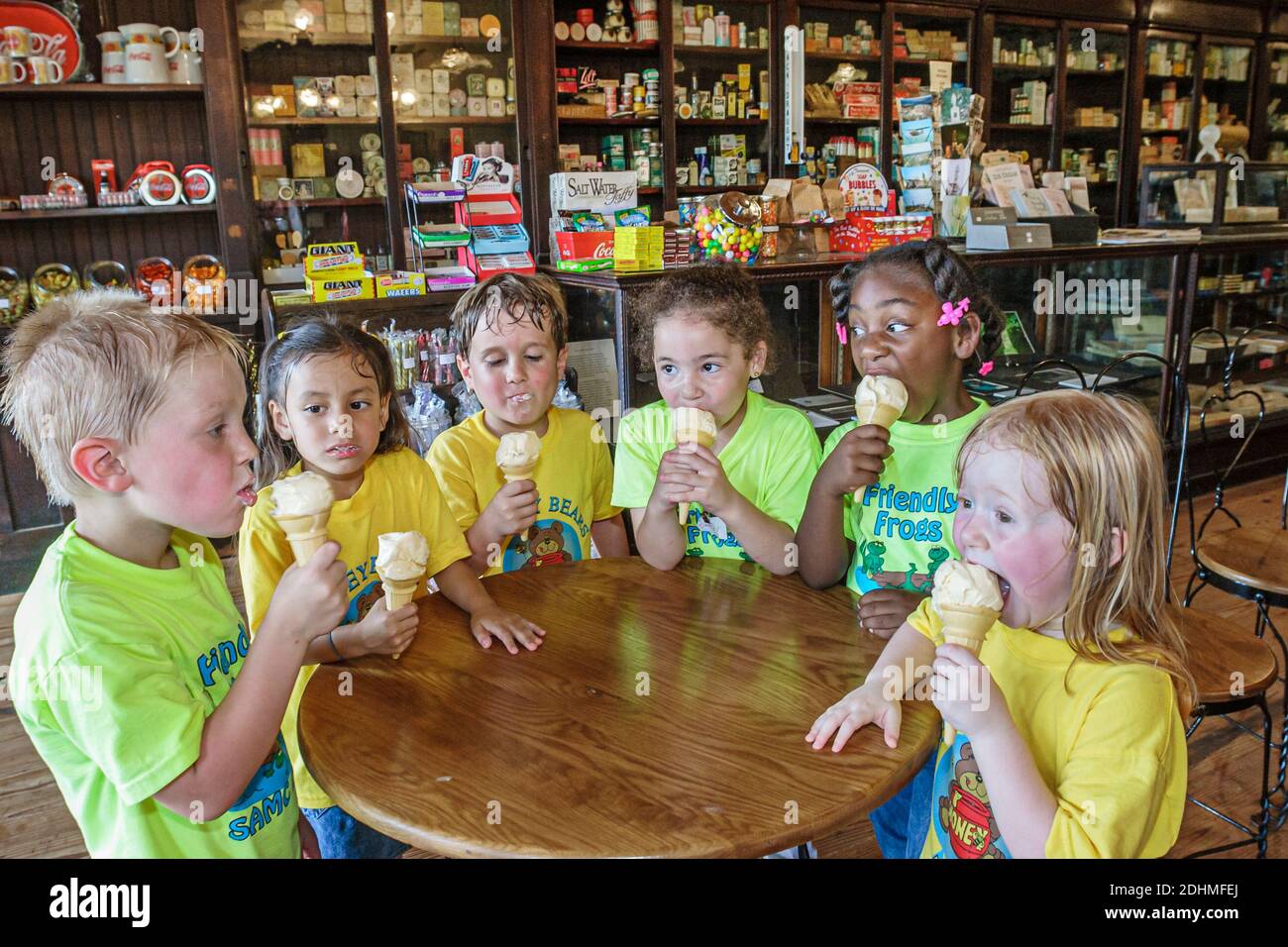 Alabama Dothan Landmark Park Martin Drugstore,old fashion soda fountain counter ice cream cones,class field trip Black girl children students eating, Stock Photo