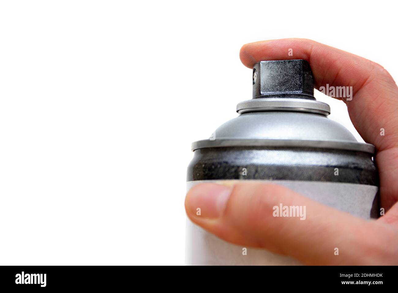 Human hand holding a graffiti Spray can, closeup view of upper part of ...