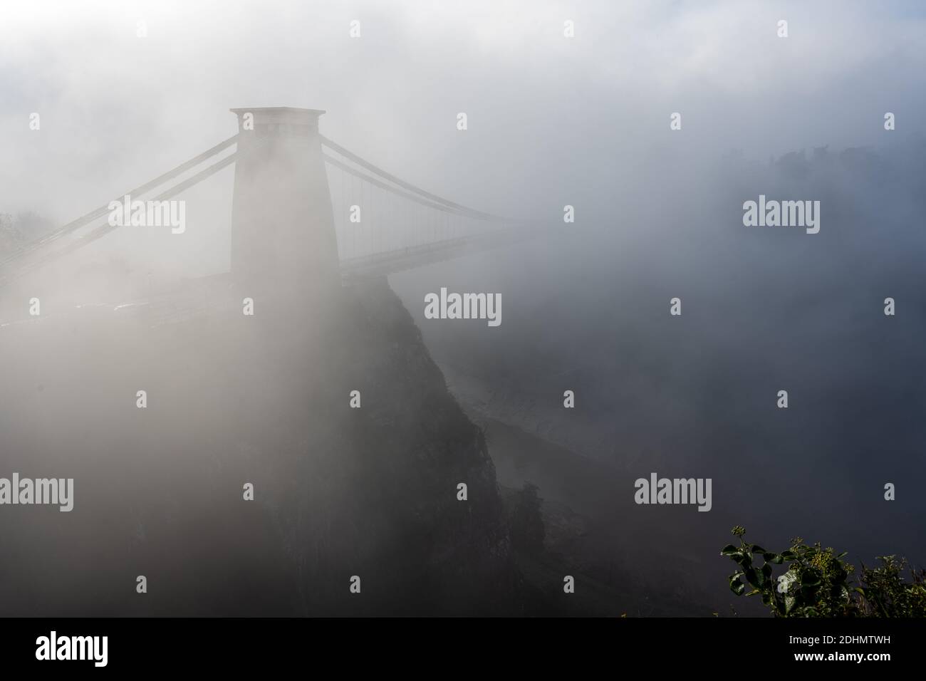 Fog shrouds the landmark Clifton Suspension Bridge in Bristol. Stock Photo