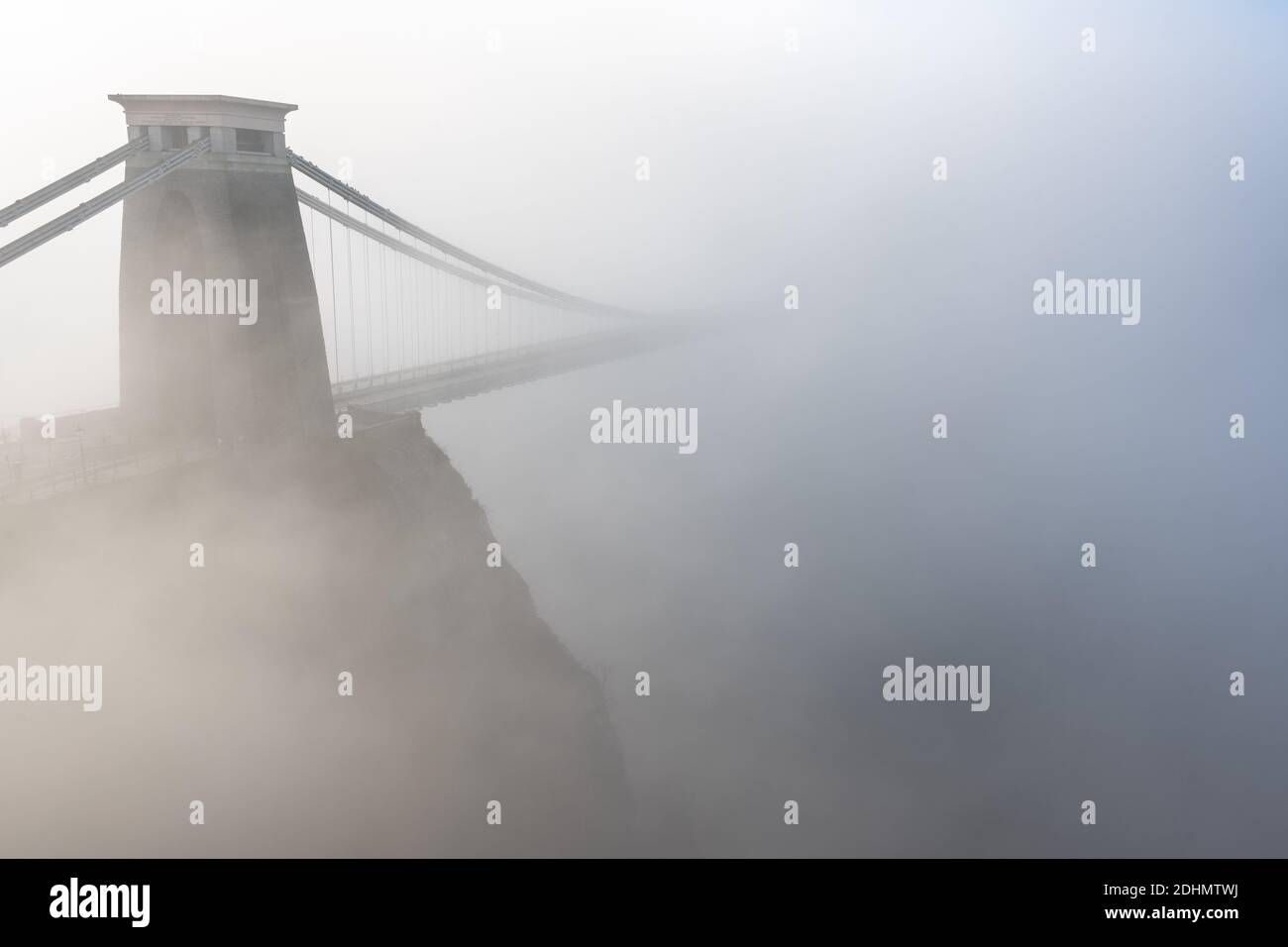Fog shrouds the landmark Clifton Suspension Bridge in Bristol. Stock Photo