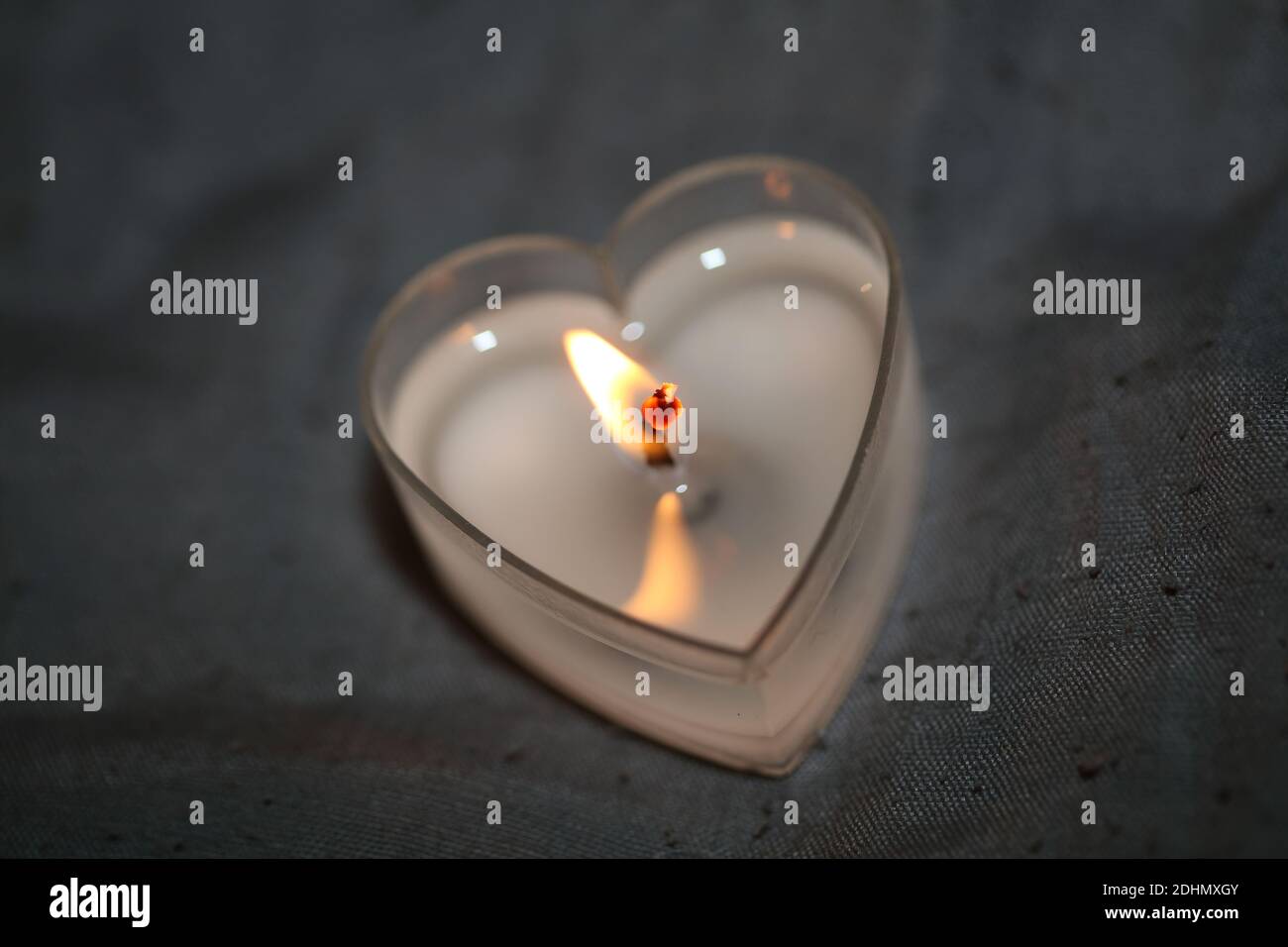 Burning heart shape romantic candle close up background modern high quality stock photography print Stock Photo