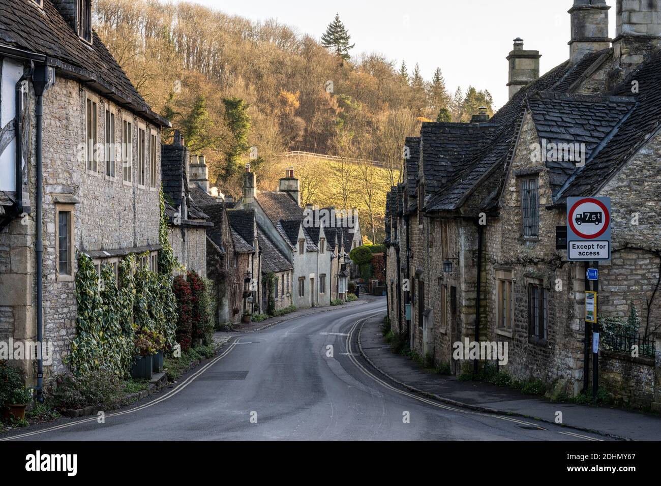 Traditional stone cottages line The Street in the picturesque Cotswolds