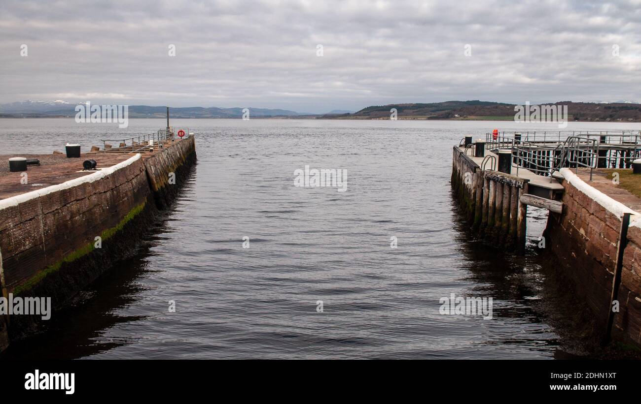 The Caledonian Canal meets the North Sea at Clachnaharry Sea Loch in Inverness. Stock Photo