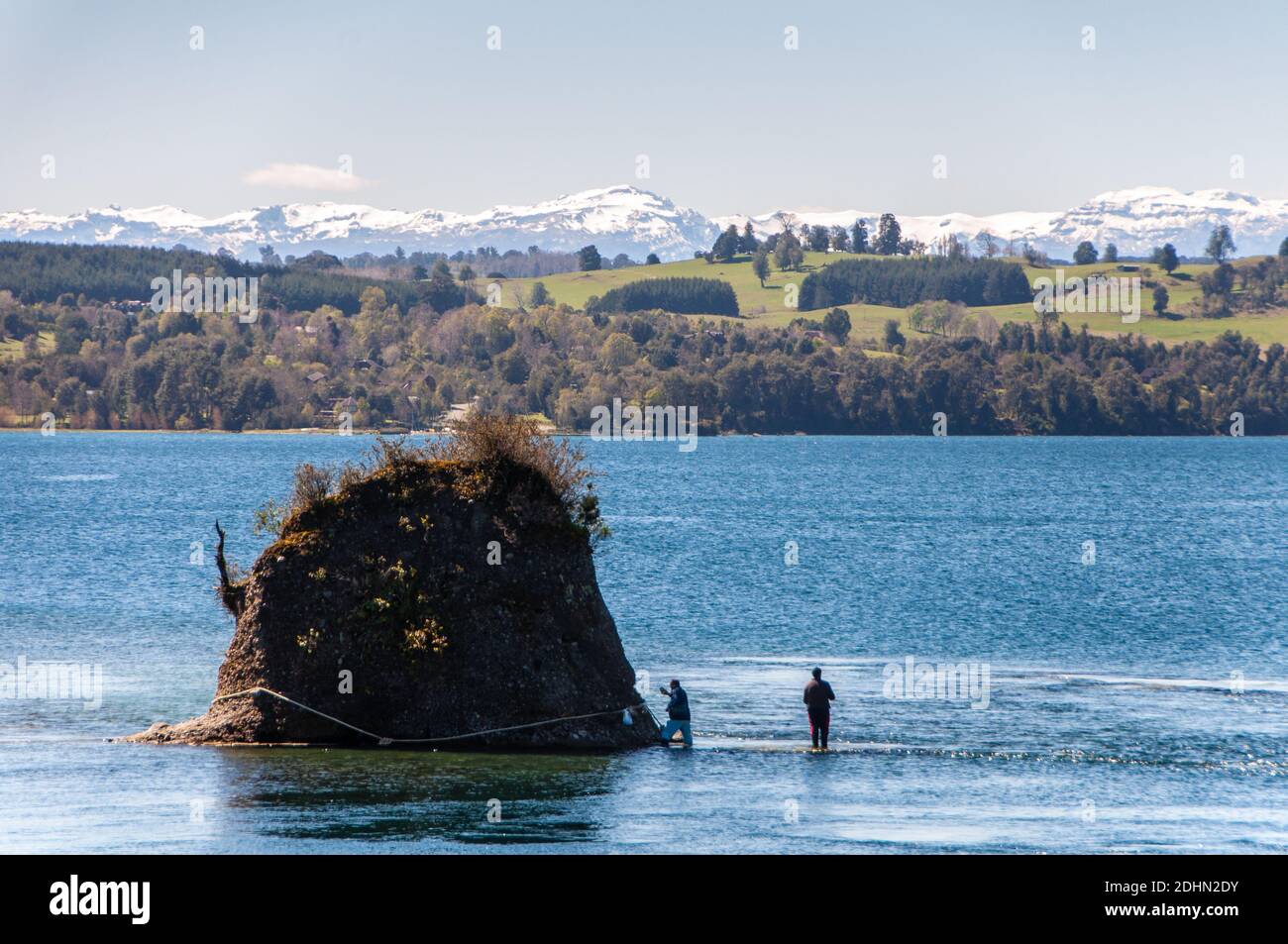 Osorno, Chile - September 27, 2009: Two men stand fishing in Lago ...