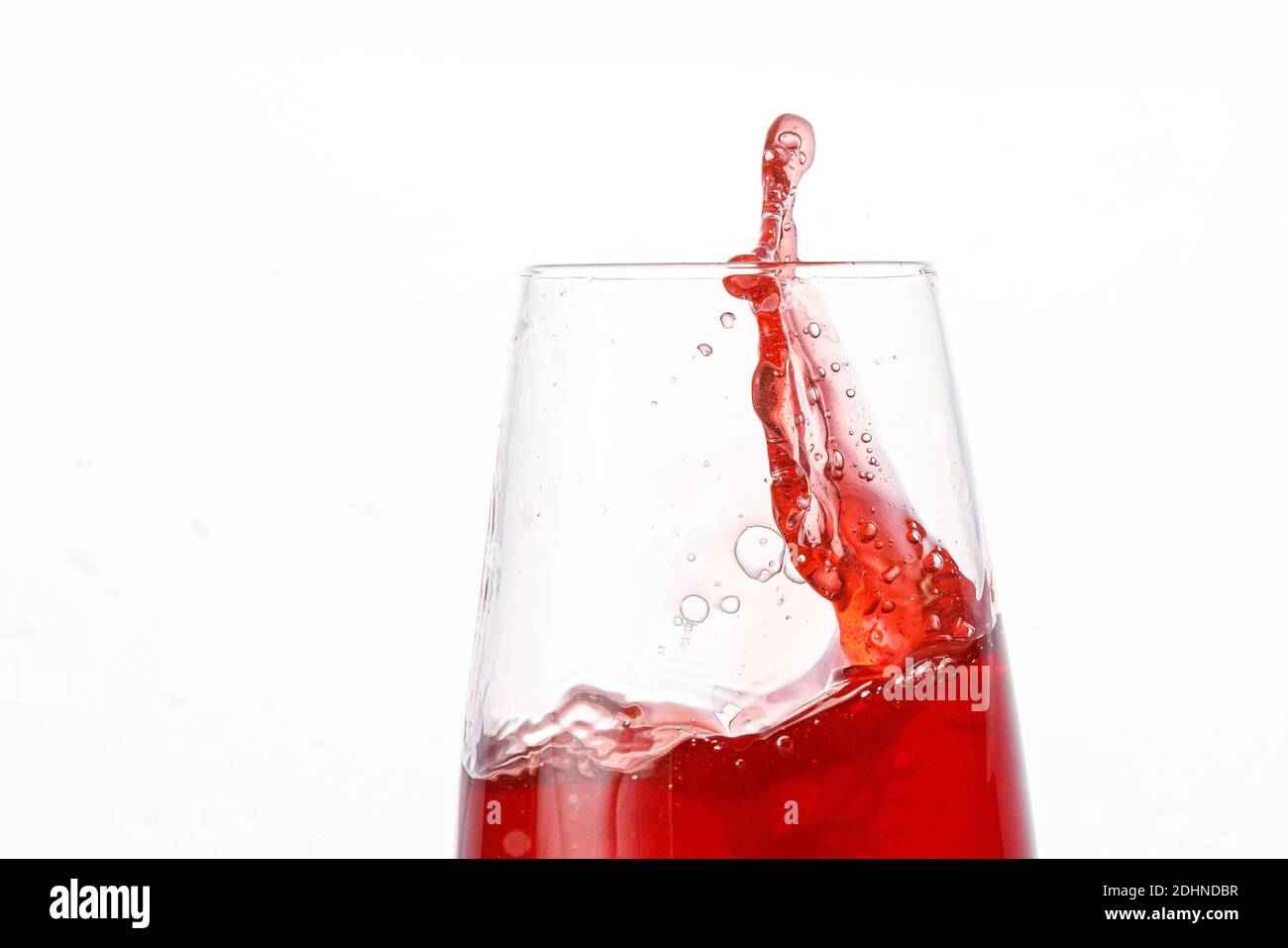 Red juice splashes on isolated white background Stock Photo