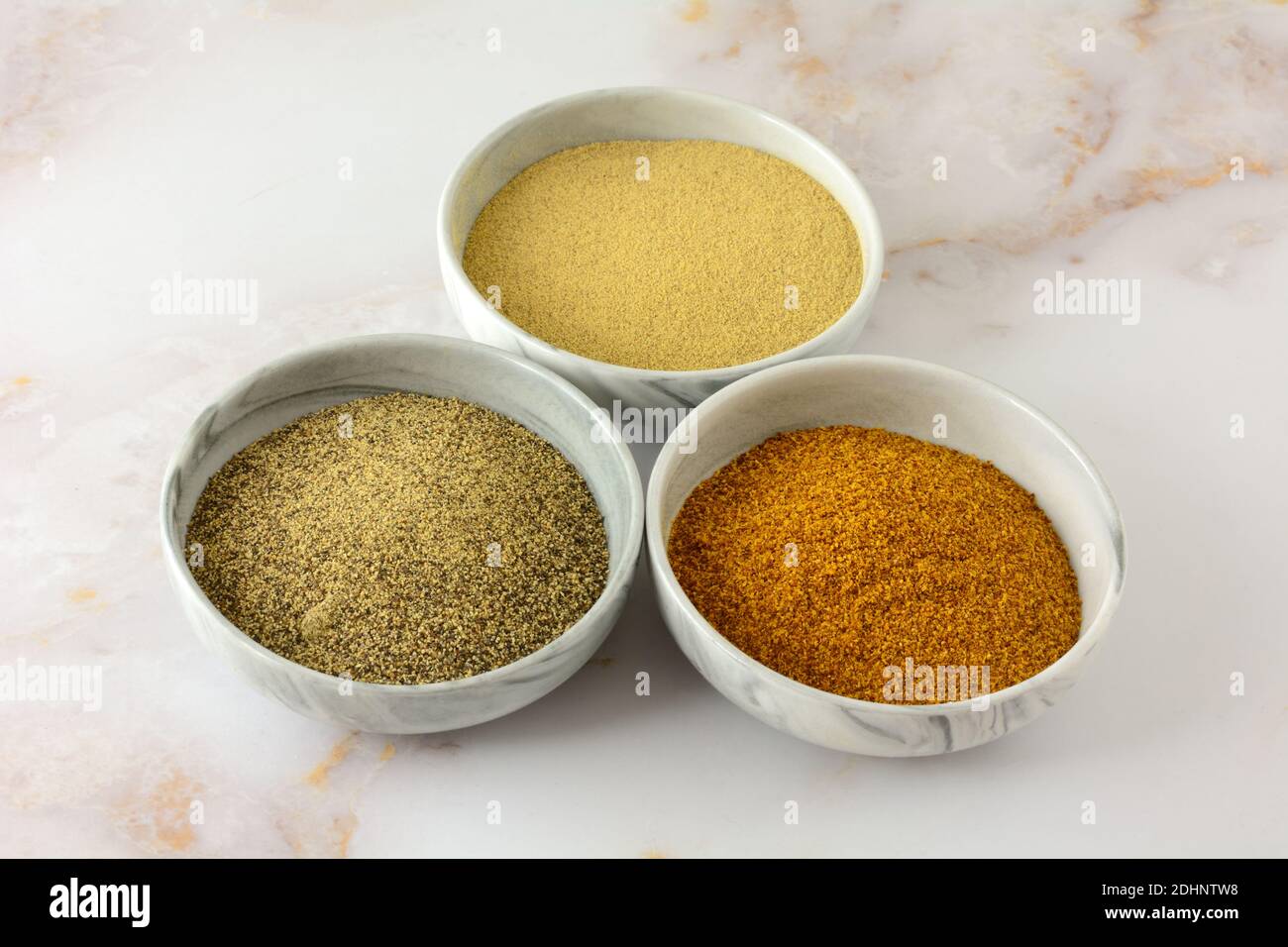 Ground white pepper, black peeper and red pepper spices in ingredient