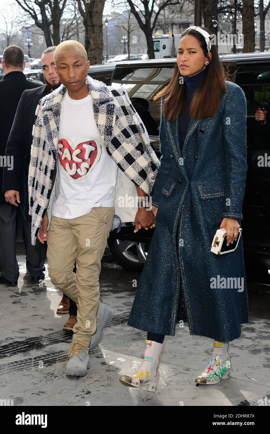 Pharrell Williams and Helen Lasichanh arriving to the Chanel show