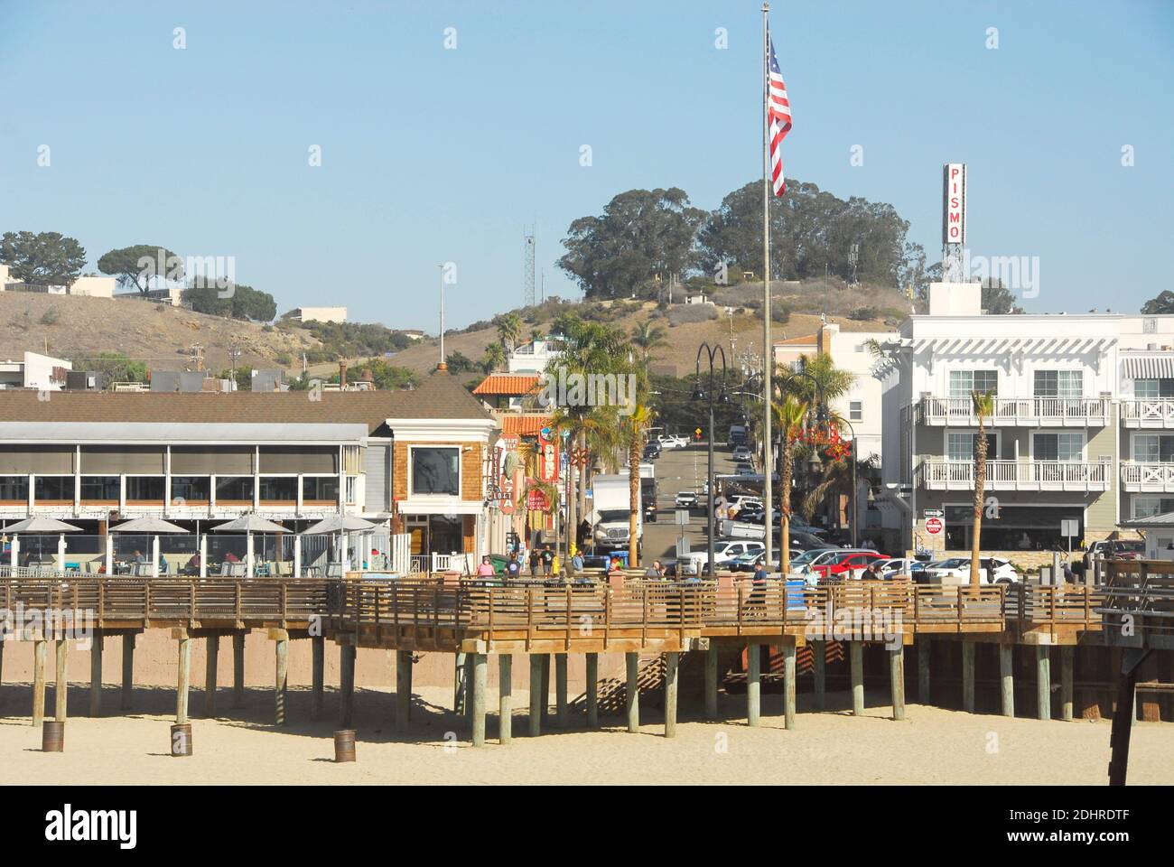 View of the town from the pier of Pismo Beach in San Luis Obispo County, California, famous for its Pismo Clams, beaches, and sand dunes. Stock Photo