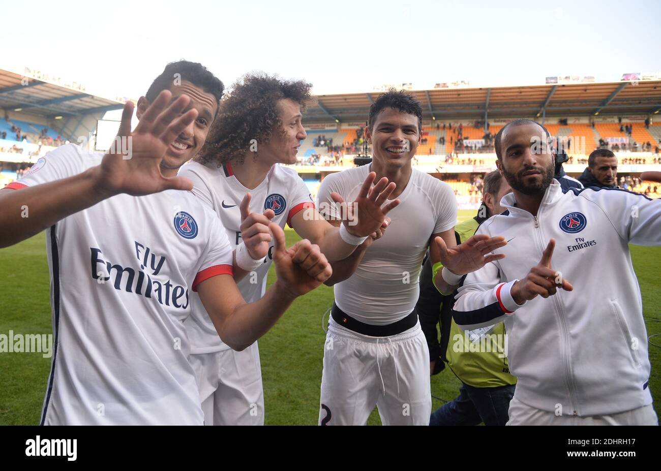PSG's Marquinhos, David Luiz, Thiago Silva and Lucas Moura celebrate during the French First League Football match,Troyes vs. Paris Saint-Germain at the Aube Stadium in Troyes, France on on March 13, 2016. PSG won 9-0. Paris Saint-Germain clinched a fourth consecutive Ligue 1 title in record time on March 13 after defeating Troyes, obliterating a new French record for the quickest league victory with eight games to spare before the end of the L1 championships. Photo by Christian Liewig/ABACAPRESS.COM Stock Photo