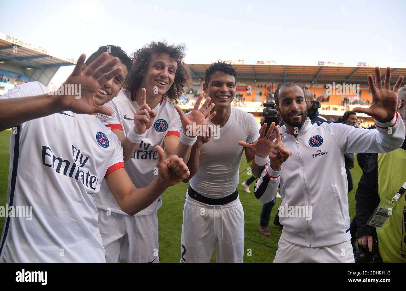PSG's Marquinhos, David Luiz, Thiago Silva and Lucas Moura celebrate during the French First League Football match,Troyes vs. Paris Saint-Germain at the Aube Stadium in Troyes, France on on March 13, 2016. PSG won 9-0. Paris Saint-Germain clinched a fourth consecutive Ligue 1 title in record time on March 13 after defeating Troyes, obliterating a new French record for the quickest league victory with eight games to spare before the end of the L1 championships. Photo by Christian Liewig/ABACAPRESS.COM Stock Photo