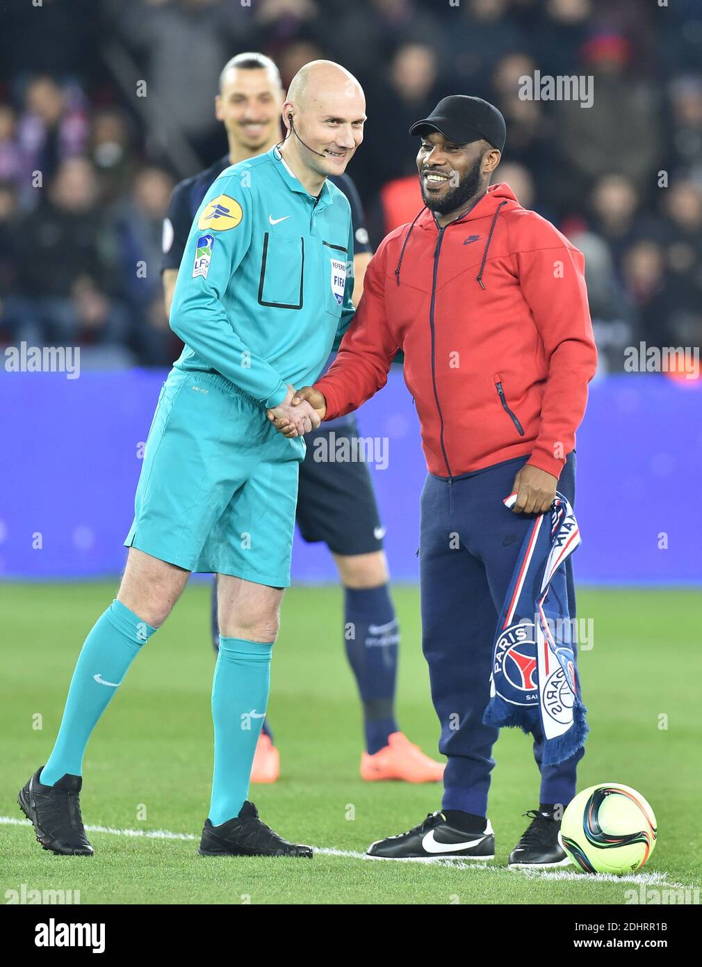 Jay Jay Okocha, had been played in PSG between the years1998 - 2002  gestures after he made the start kick during the French L1 football match  between Paris Saint-Germain and Monaco at