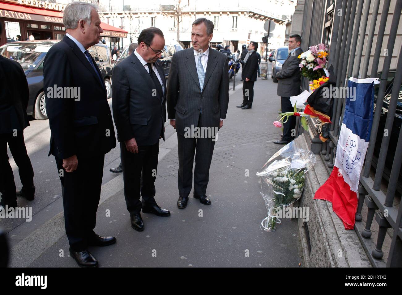 France's President Francois Hollande (C), Minister of Foreign Affairs and International Development Jean-Marc Ayrault (L) and Belgium's Ambassador to France Vincent Mertens de Wilmars pay homage to the victims of the Brussels terror attacks outside the Belgium embassy in Paris, France on Tuesday, March 22, 2016. Bombs exploded at the Brussels airport and one of the city's metro stations earlier today, killing at least 34 and injuring dozens of people. The Islamic State group claimed responsibility for the attacks. Photo by Thibault Camus/Pool/ABACAPRESS.COM Stock Photo