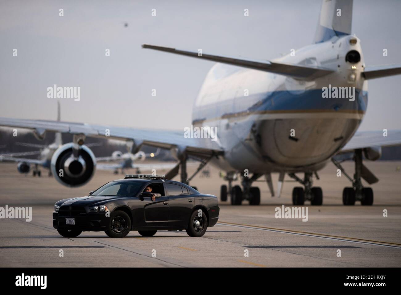 A military police officer sits in his car on the tarmac after Air Force One arrived, with US President Barack Obama aboard, at Joint Base Andrews, Maryland, USA, 25 March 2016. President Obama returned on the over night flight from his trip to Cuba and Argentina.Photo by Shawn Thew/Pool/ABACAPRESS.COM Stock Photo
