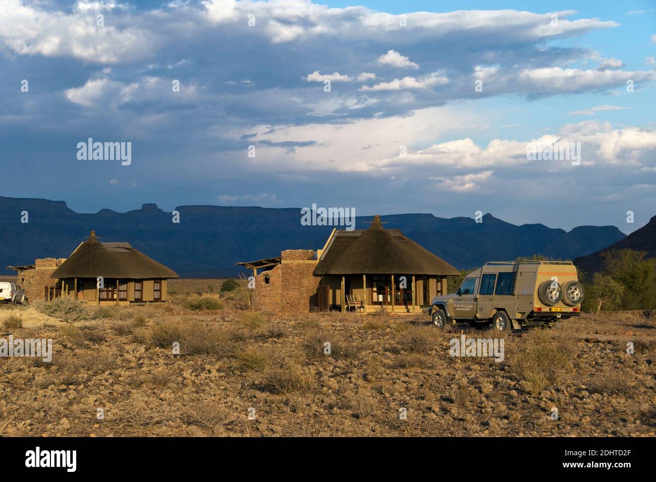 Luxury rondavels (private chalets) at a desert lodge near the famous red sand-dunes of Sossusvlei inside the Namib-Naukluft Park, Namibia. Stock Photo