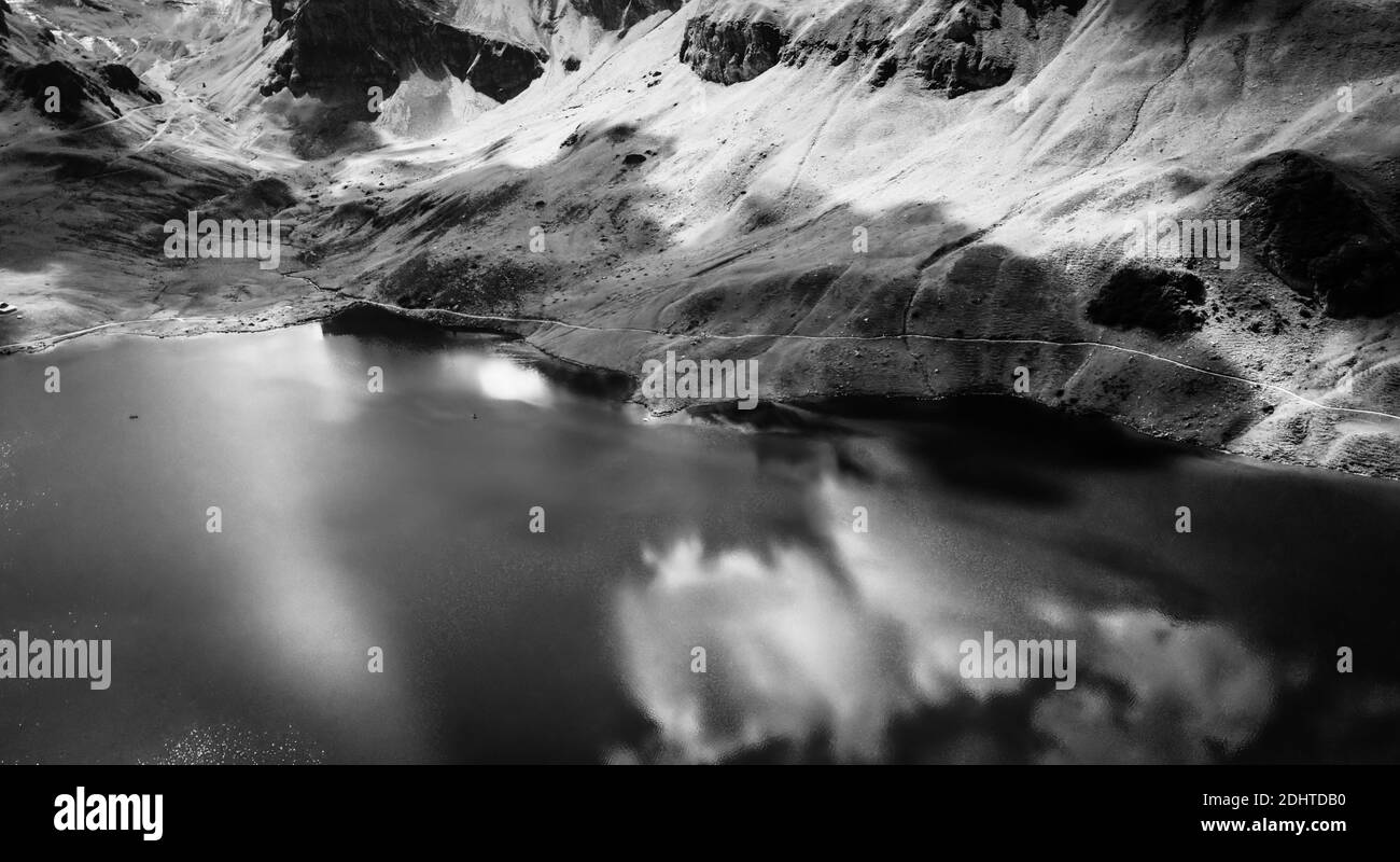 The Swiss Alps at Melchsee Frutt in black and white Stock Photo