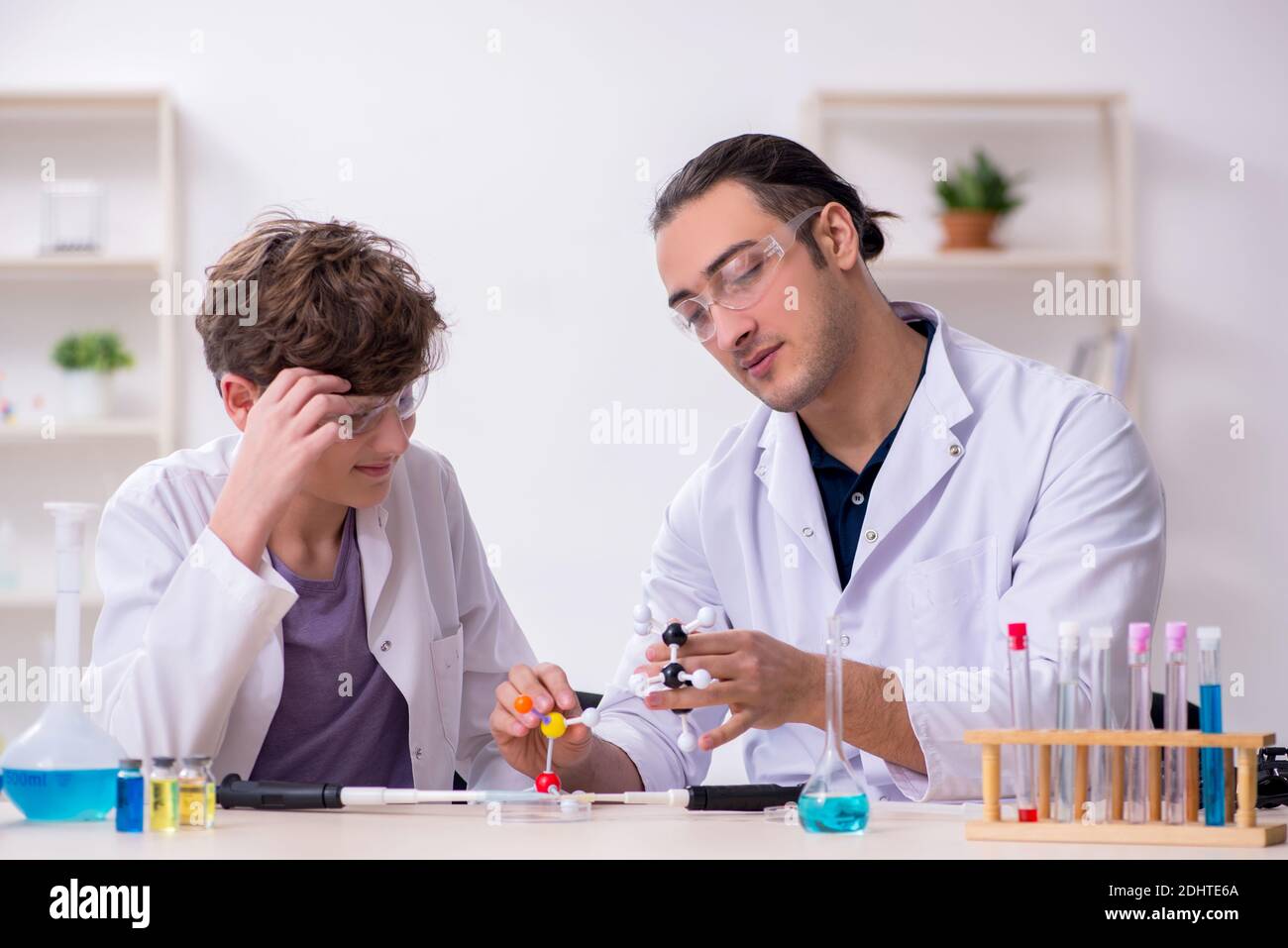 Young father and son chemists in the laboratory Stock Photo - Alamy