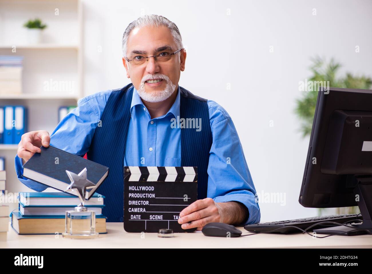 Old male author writing the screenplay Stock Photo - Alamy
