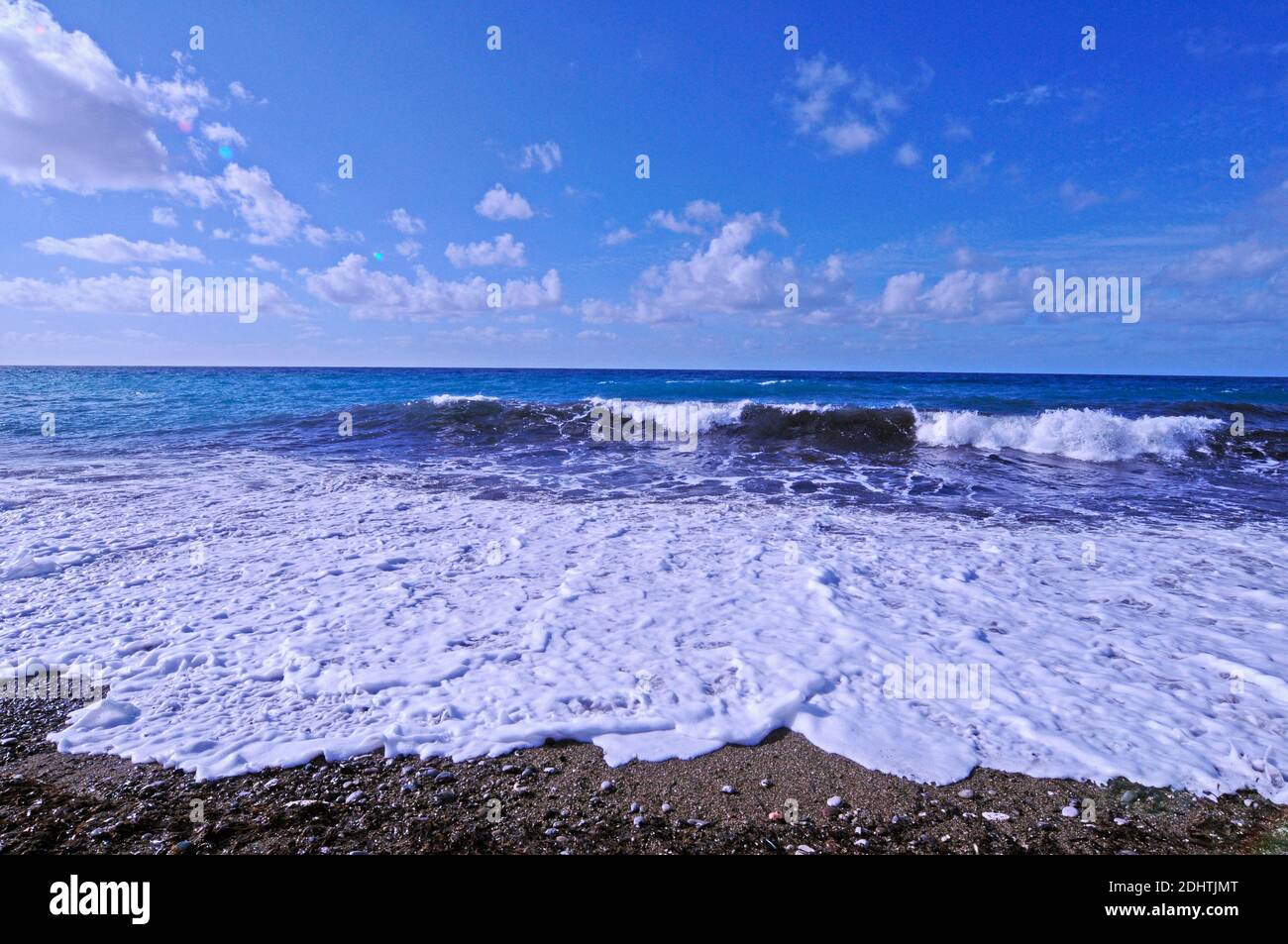Breaking waves on a deserted beach in the Akamas Paphos Cyprus Stock Photo