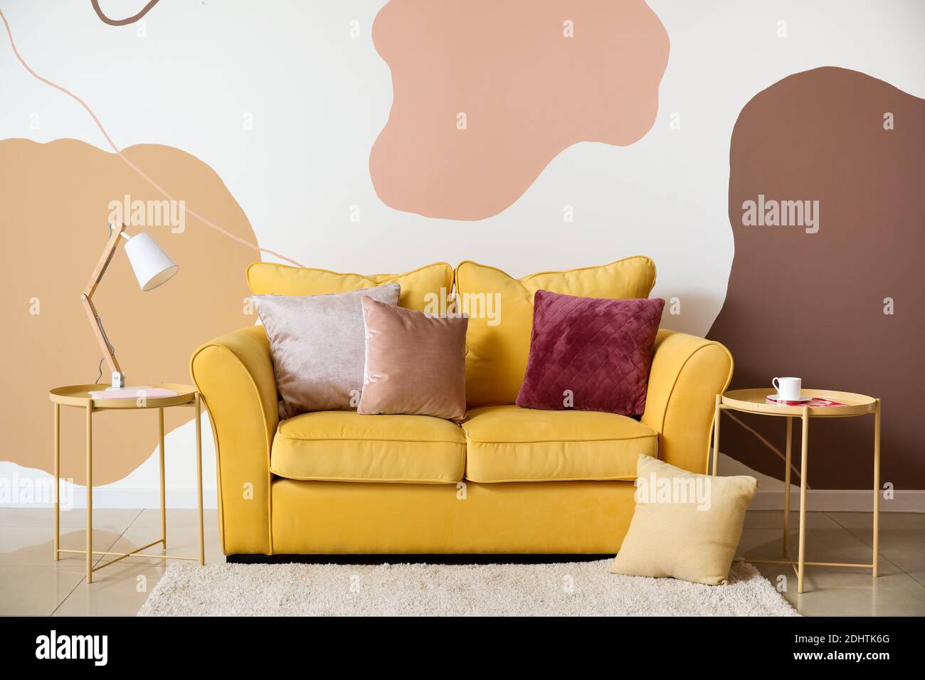 Stylish interior of room with cozy sofa Stock Photo - Alamy
