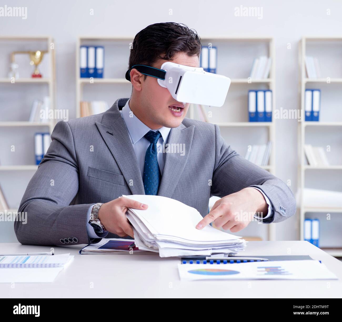 The businessman with virtual reality glasses in the office Stock Photo ...