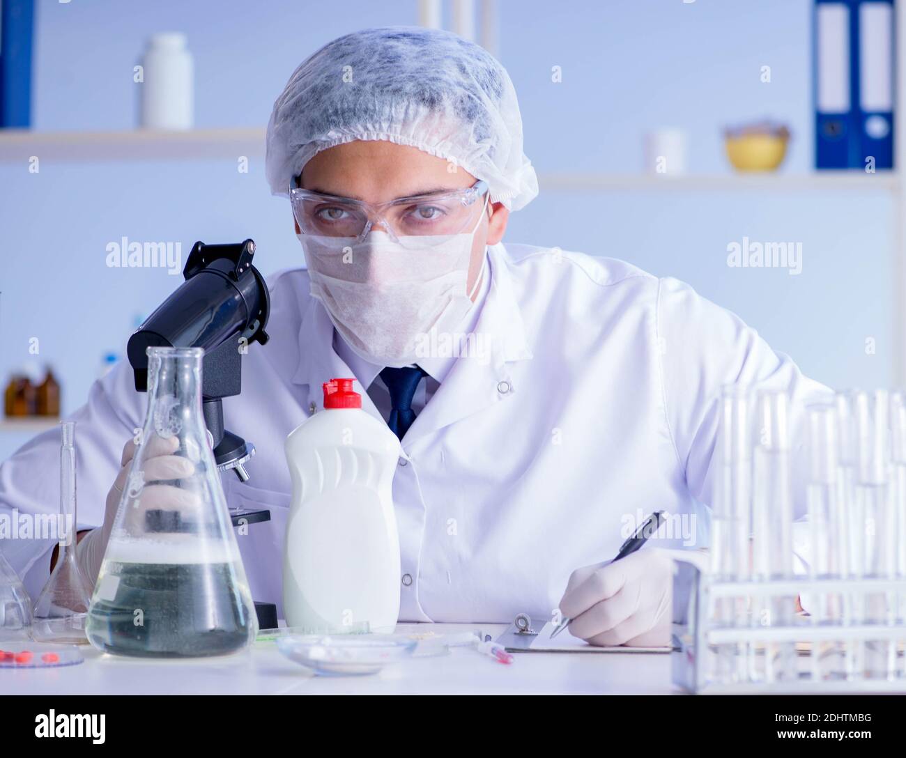 The man in the lab testing new cleaning solution detergent Stock Photo