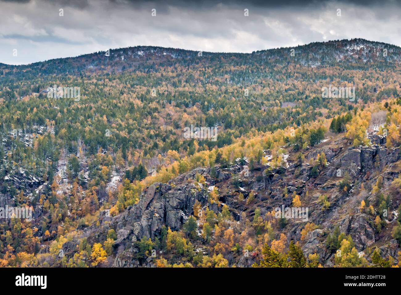 Rocky mountain ranges in autumn forest Stock Photo - Alamy