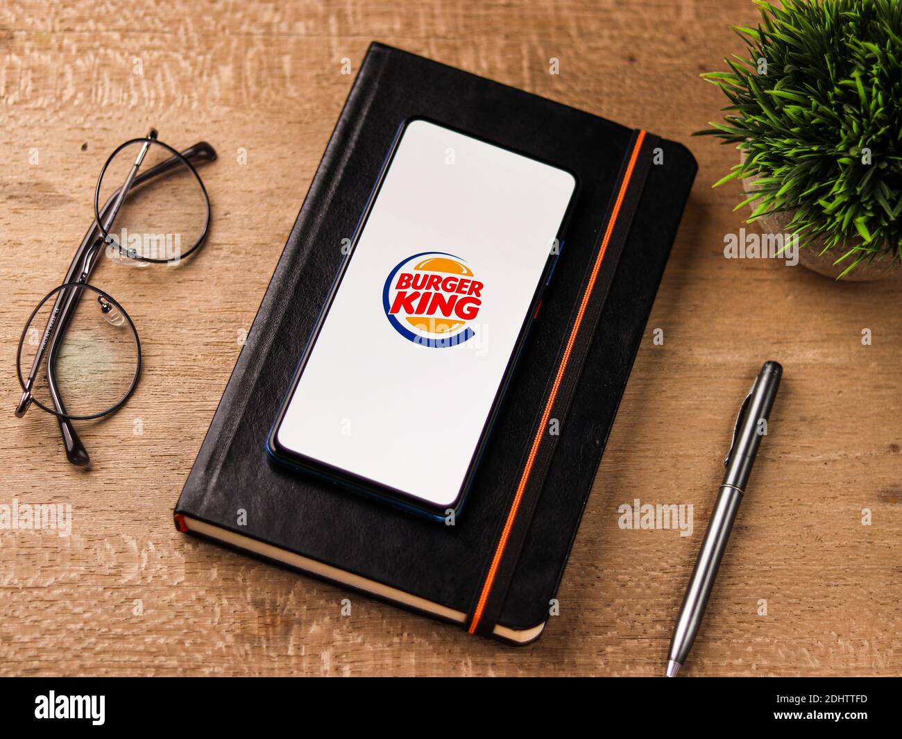 Assam, india - December 20, 2020 : Burger King logo on phone screen stock image. Stock Photo