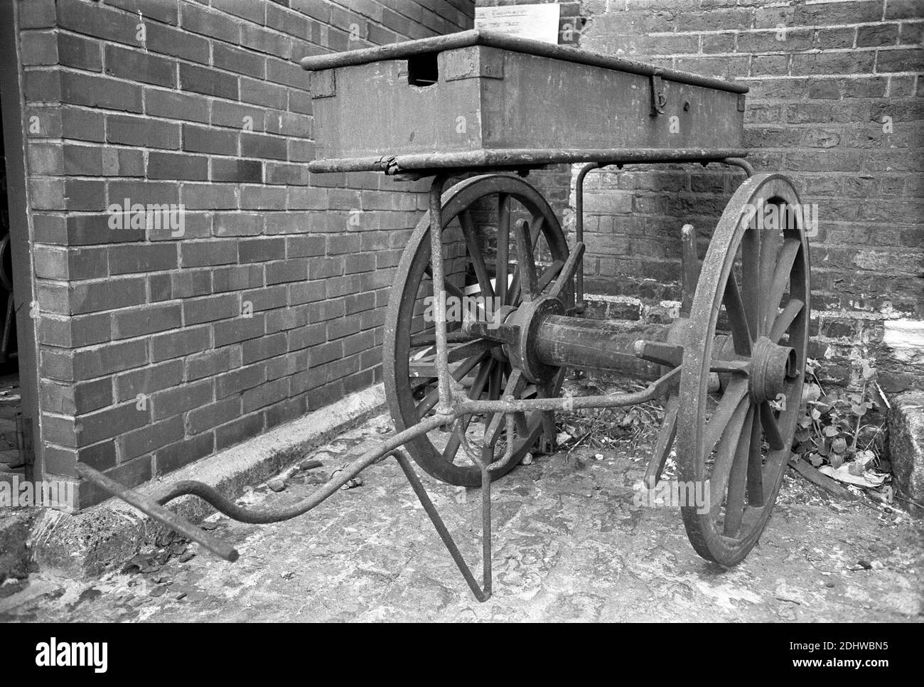 UK, London, Docklands, Isle of Dogs, shipping docks, early 1974. A firefighting handcart. The hose would be wrapped around the axle. Stock Photo