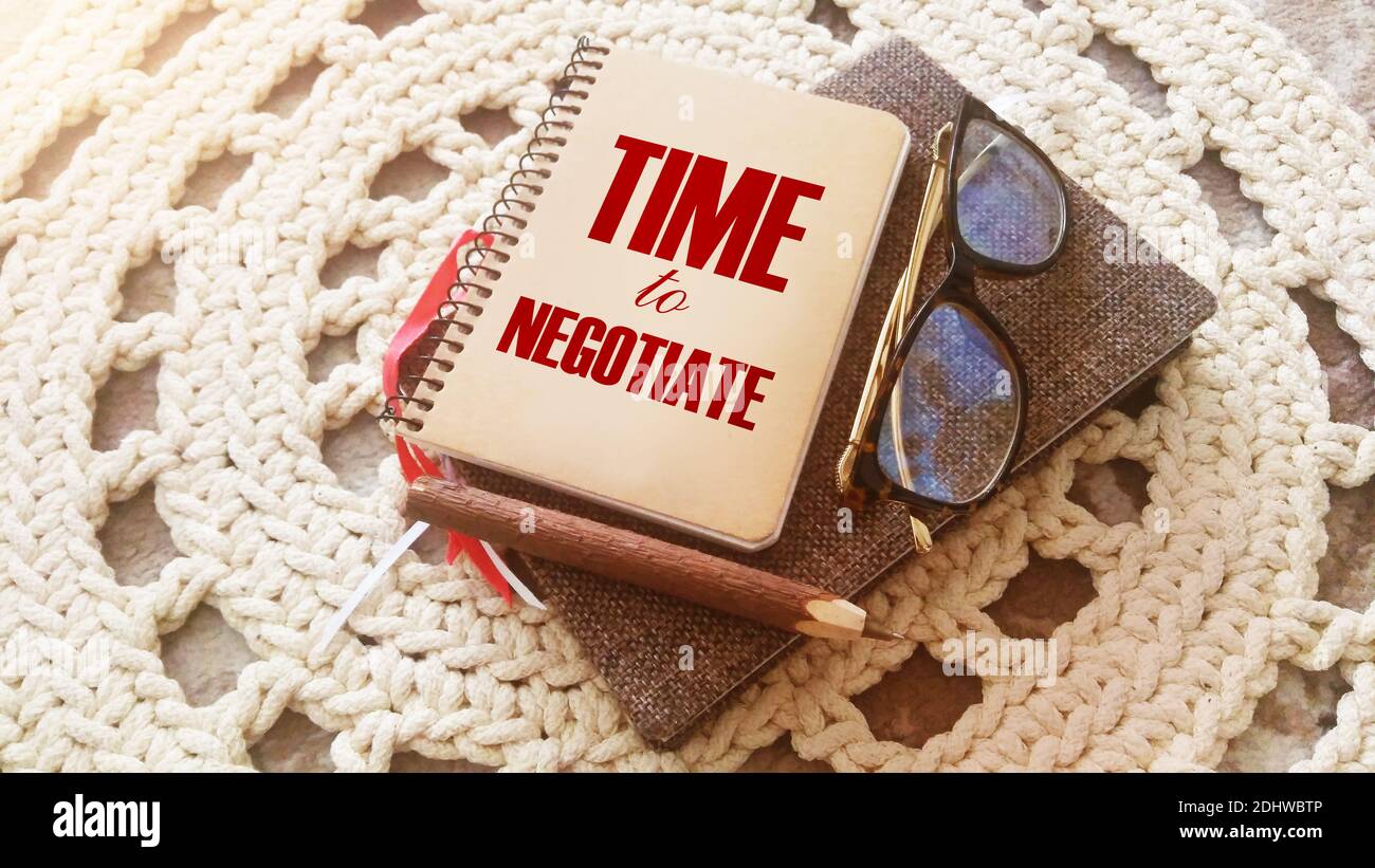 Business concept. Notebook with text TIME TO NEGOTIATE sheet of white ...
