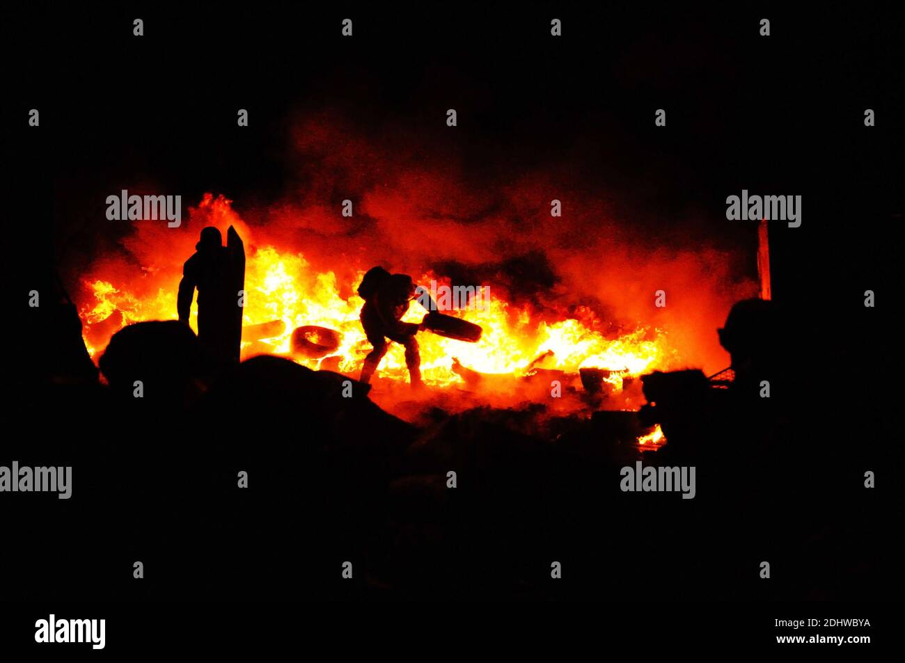 Ukrainian crisis.Protester refugee is burning tires to stop the riot police. Street fights in Kyiv, Ukraine. Ukraine crisis. Fires of a Revolution. Stock Photo