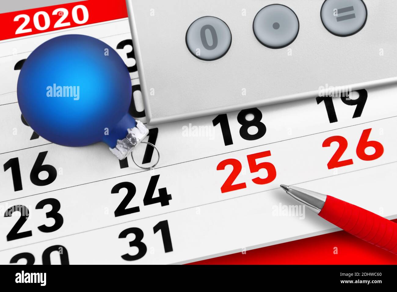 Christmas time 2020 calendar with calculator and red pen Stock Photo