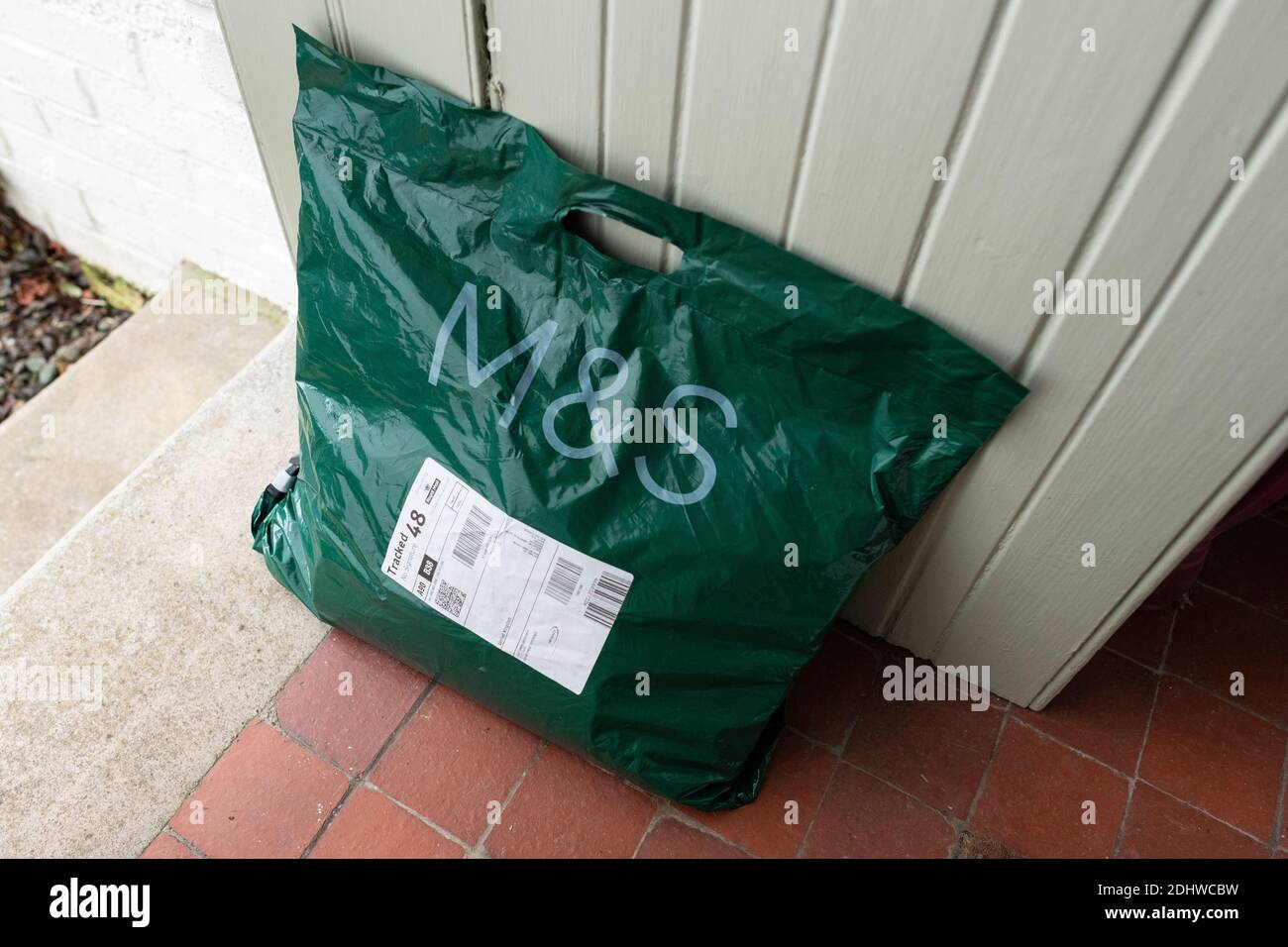 Marks and Spencer M&S parcel package delivery on door step during coronavirus pandemic - UK Stock Photo