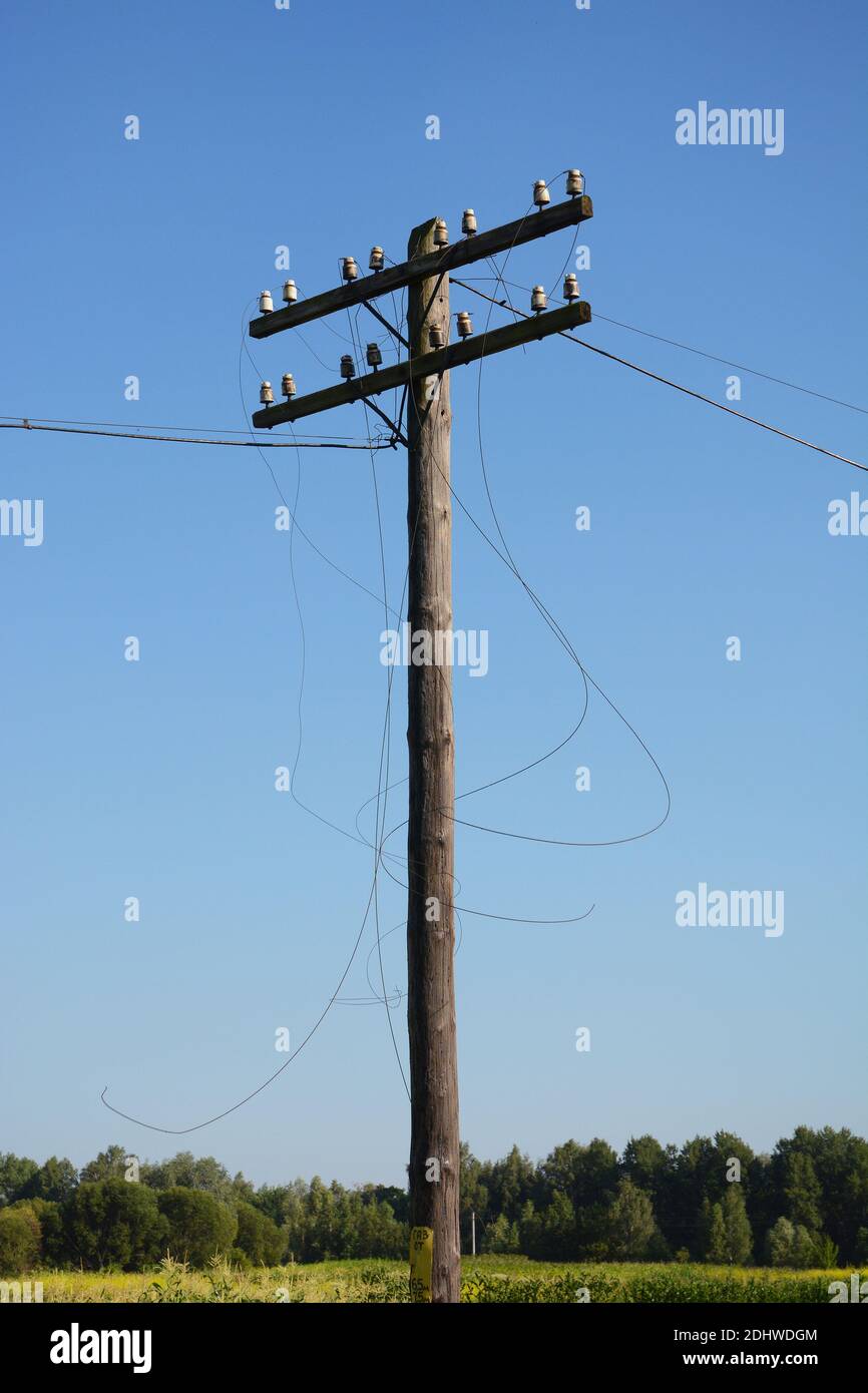 Electric post power pole. Wire breakage after hurricane. Broken power
