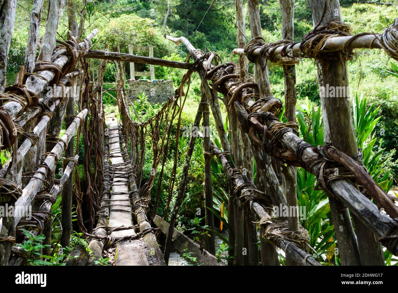 Traditional suspension bridge in the Baliem Valley, West Papua, Indonesia Stock Photo