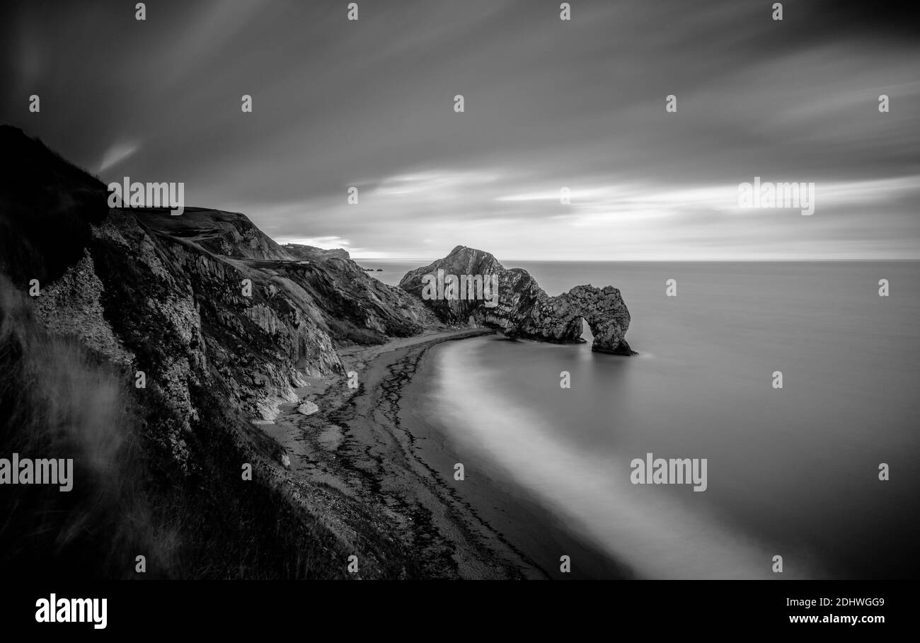 Long exposure image of Durdle Door rock arch seen from the cliff top. Stock Photo