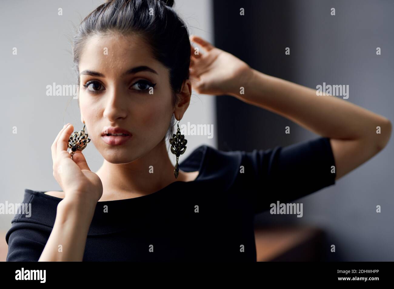 romantic woman model portrait earrings makeup and evening dress light ...