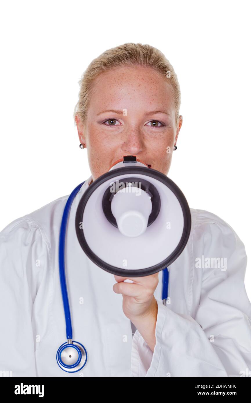 Eine junge Ärztin mit einem Megaphon macht eine Durchsage Stock Photo