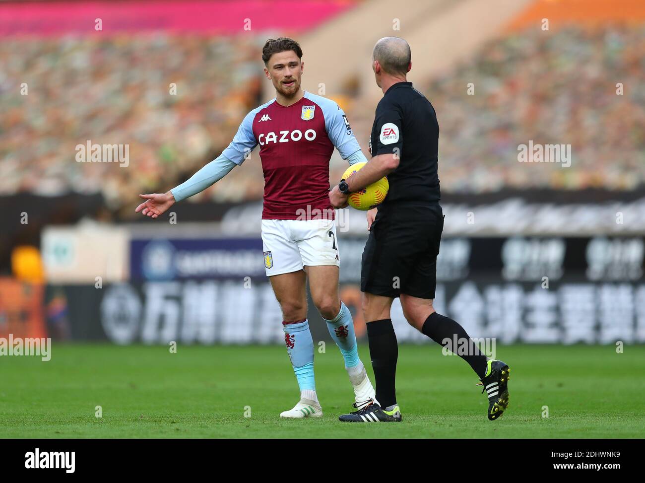 Aston Villa's Matty Cash speaks with referee Mike Dean during the ...