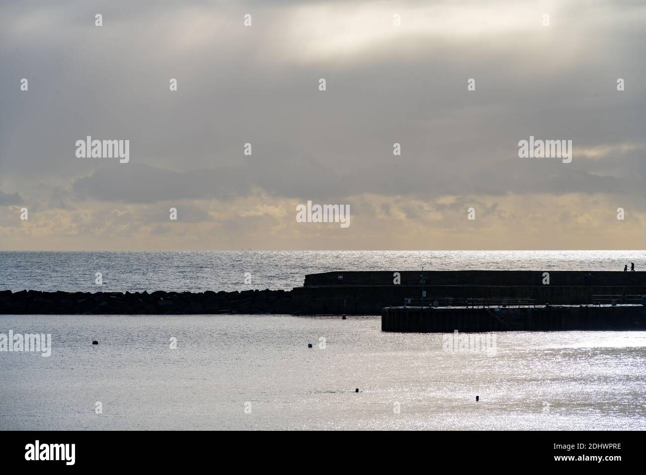 Lyme Regis, Dorset, UK. 12th Dec, 2020. UK Weather: A weather front moves in after a bright, sunny morning at the coastal resort town of Lyme Regis. Credit: Celia McMahon/Alamy Live News Stock Photo