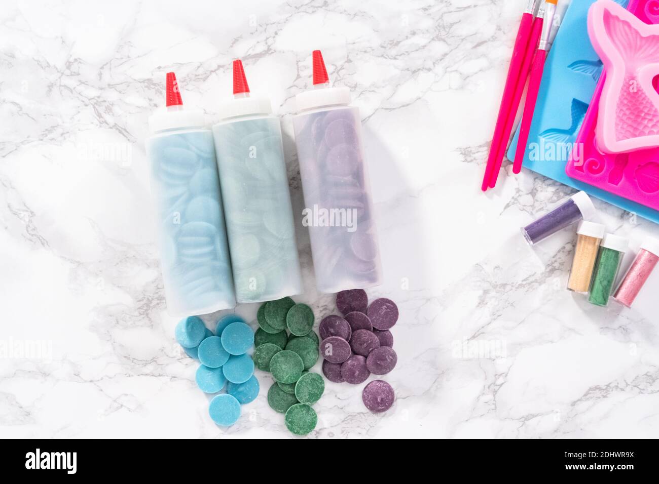 Flat lay. Ingredients to make chocolate mermaid molds from the chocolate chips. Stock Photo