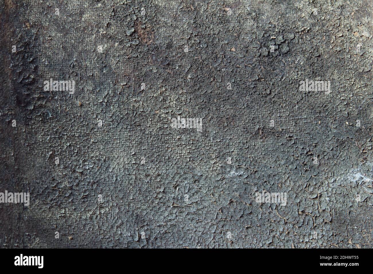 Thick dirt that forms on an old surface. Cracked texture background. Stock Photo