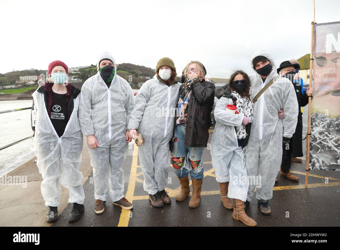 Teignmouth, South Devon, UK. 12th Dec, 2020. Members of Ocean Rebellion XR and the Red Rebels staged a peaceful protest in the seaside resort of Teignmouth. Protestors are calling for sludge dumping from Exmouth Docks to be stopped from dumping 10,000 tons of pollutants into an area of the sea where juvenile fish are developing.Locals feel angry that the sludge dumping took place during the lock down when protests could not legally take place. Credit: Natasha Quarmby/Alamy Live News Stock Photo